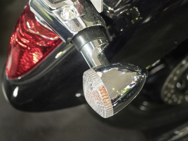 Detailed view of a motorbike tail light and indicator in chrome with black paint, dortmund,