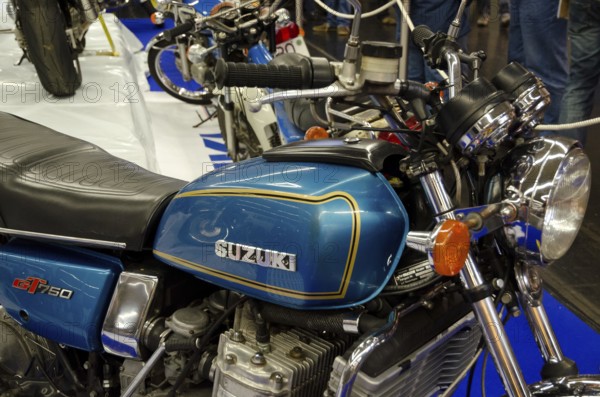 Blue Suzuki motorbike GT750 in retro style with chrome-coloured details at a trade fair, dortmund,