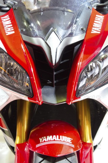 Sporty Yamaha motorbike in red and white colour with distinctive headlights and logos, dortmund,