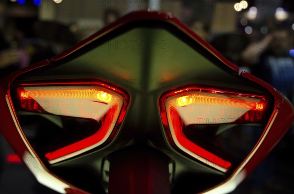 Futuristic designed red tail lights of a motorbike in detail, dortmund, germany