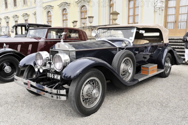 Elegant black convertible classic car in front of a historic building, Retro Classics meets
