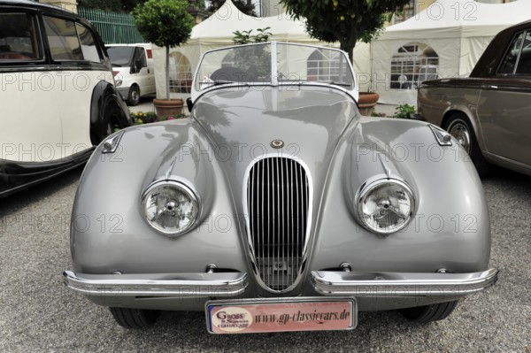 Grey Jaguar convertible with elegant front and classic vintage car charm, Retro Classics meets