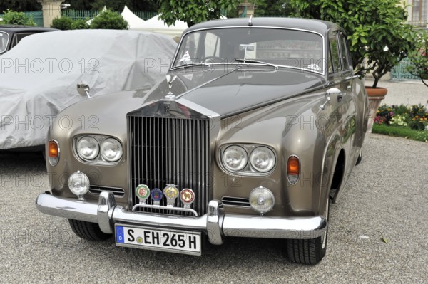 Grey classic Rolls-Royce vintage car with badge on the radiator grille, Retro Classics meets