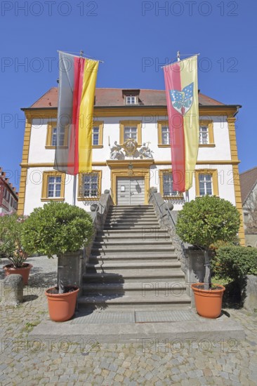 Baroque town hall built in 1739 with German national flag and town flag, open staircase, entrance,