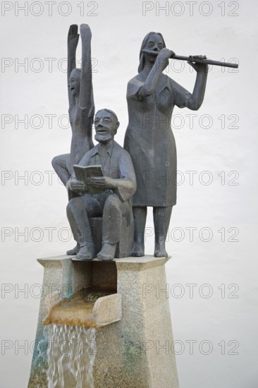 Fountain for civil servants with sculptures, book reader, flute player, modern art, bronze