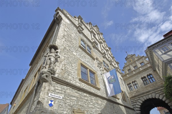 Renaissance town hall built in 1581 with statue of St George and Main Gate, town flag, town gate,