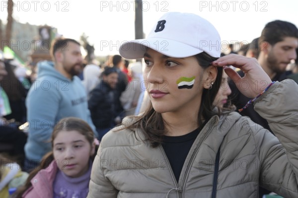 Thousands of Syrians take to public squares and main streets waving the revolutionary flag and