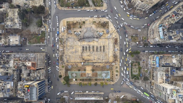 Aerial view shows Syrian public security forces staging a public parade in central Aleppo following