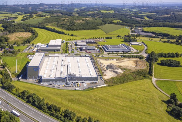 Aerial view, industrial area, industrial park Grünewald with construction site, motorway A45, hilly
