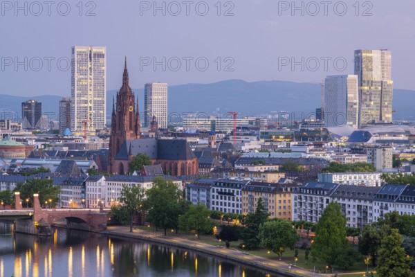 Frankfurt Cathedral, Residential Buildings, Illuminated City and Main River at Morning Twilight.