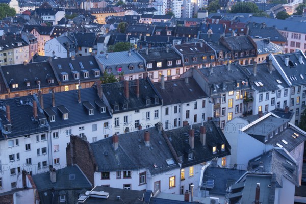 Old Residential Buildings in Frankfurt City at Evening Twilight with Illuminated Windows. Aerial