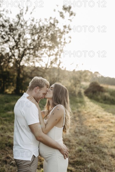 Pregnant, young woman with partner