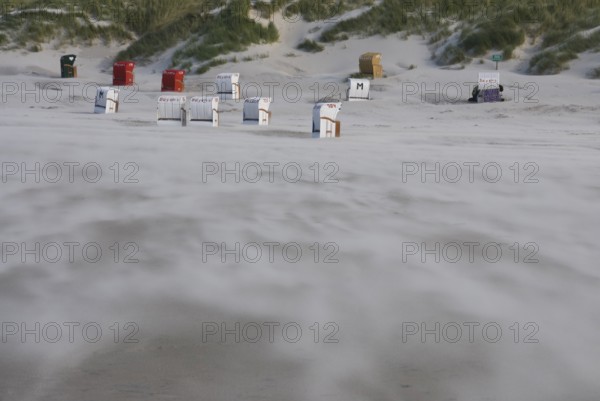 A strong storm whistles across the desert-like western beach of the North Frisian island of Amrum,