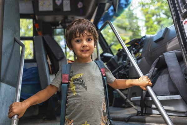 Happy preschool student entering a school bus, gripping the handrail with excitement, embracing the