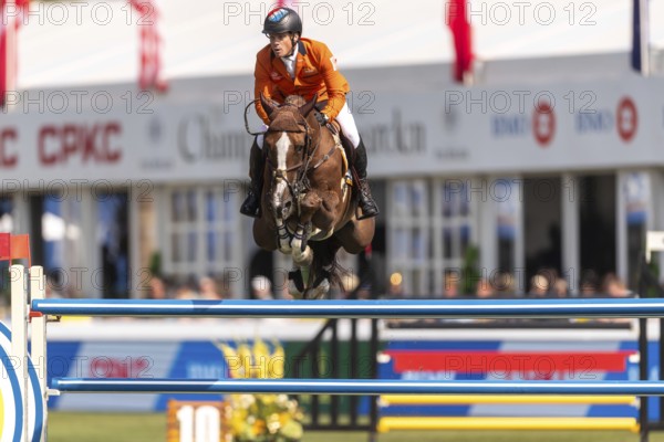Willem Greve of the Netherlands, riding Pretty Woman Van't Paradujs, competes in the first round of