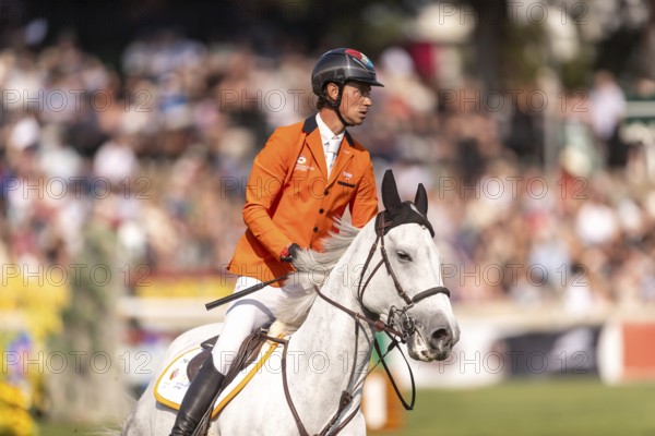 Kevin Jochems of the Netherlands, riding Camilla Van de Helle, competes in the first round of the