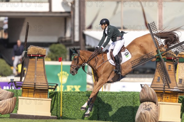Gabriel De Matos Machado of Brazil, riding Nyles Van de Mottelhoeve, competes in the first round of