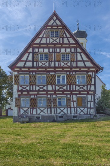 Pointed gable façade with half-timbering next to the hospital chapel in Bärenweiler from 1619 near