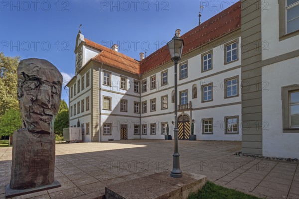 New castle with wooden sculpture by Klaus Prior in Kisslegg, Allgäu, Baden-Württemberg, Germany