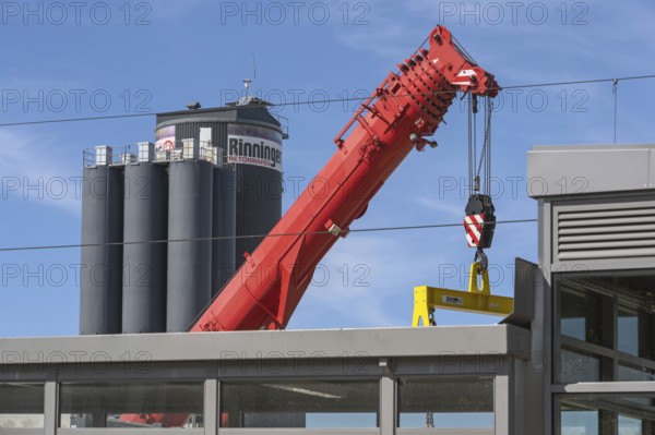 Mobile crane with telescopic boom and silos for concrete products in Kisslegg, Allgäu,