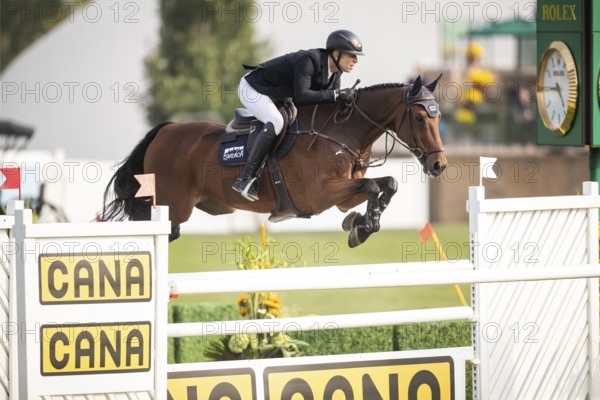 Max Kuhner of Austria, riding Elektric Blue P, competes in the 2025 Spruce Meadows Masters on