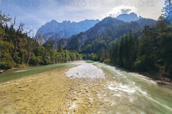 Enns with gravel bank surrounded by wooded banks, Reichenstein group in the background, Gesäuse,