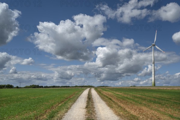 Field path and wind turbine in Franconian landscape, Karsberg, Upper Franconia, Bavaria, Germany