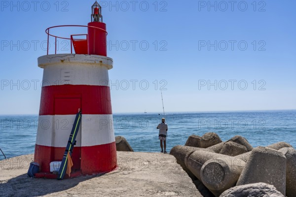 Lighthouse at the kilometre-long beach Praia da Ilha de Tavira, on the island in front of Tavira,