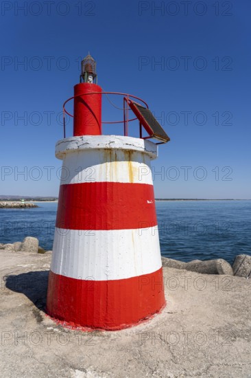 Lighthouse at the kilometre-long beach Praia da Ilha de Tavira, on the island in front of Tavira,