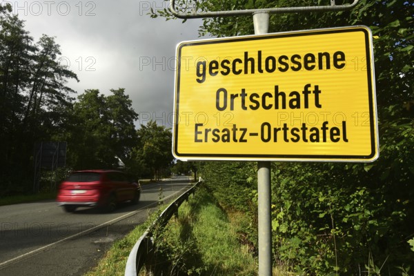 Instead of the usual place name sign, a replacement place name sign has been installed in the