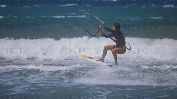 Photo of a kitesurfer jumping over the waves of the ocean, Prasonisi, beach, surf, windsurfer, kite