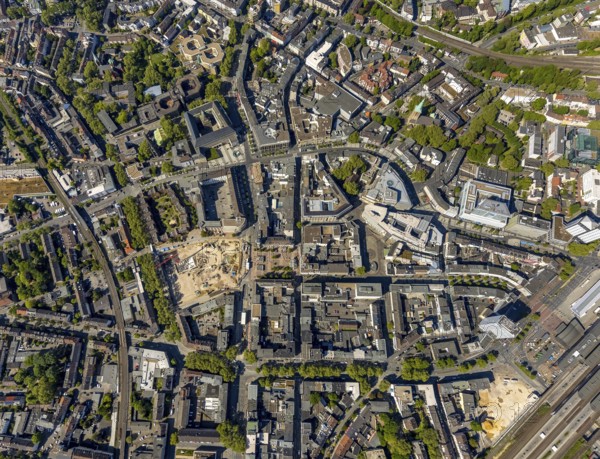 Aerial view, city centre view, construction site and new construction for three-part commercial