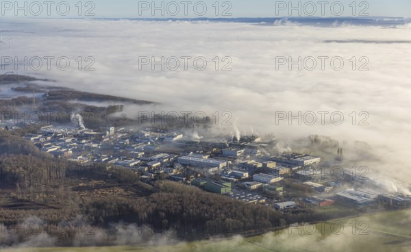 Aerial view, industrial area Westerhaar in fog and mountains of the Sauerland in backlight in