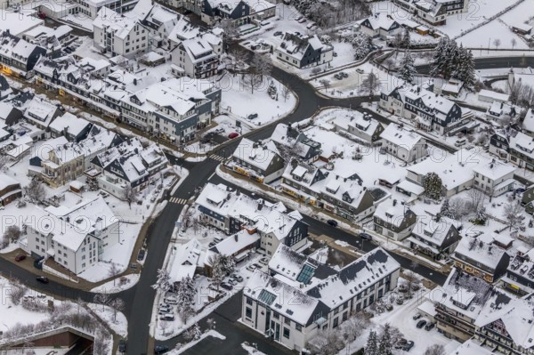Aerial view of the snowy winter landscape of Winterberg with deserted streets during the corona