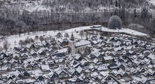 Aerial view of the snowy winter landscape of Winterberg with deserted streets during the corona