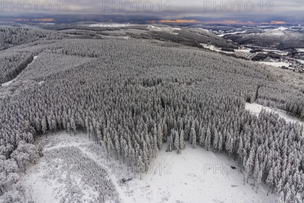 Aerial view of the snowy winter landscape of Winterberg in Sauerland in North Rhine-Westphalia,