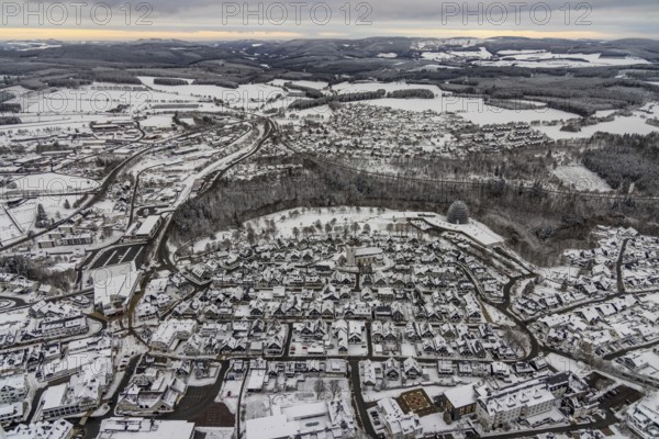 Aerial view of the snowy winter landscape of Winterberg with deserted streets during the Corona