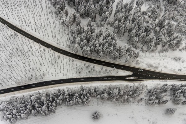 Aerial view of the snowy winter landscape of Winterberg with winding roads and paths with a