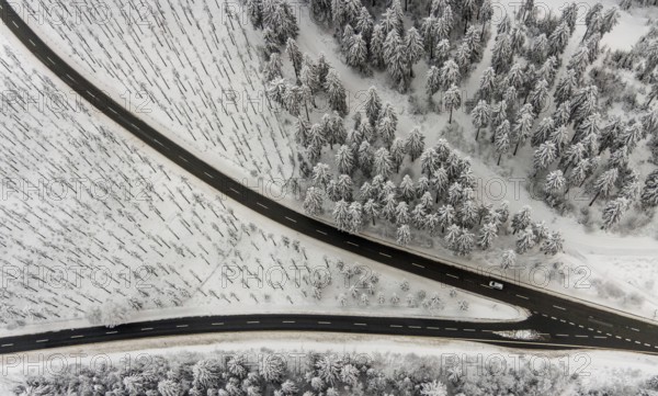 Aerial view of the snowy winter landscape of Winterberg with winding roads and paths with a