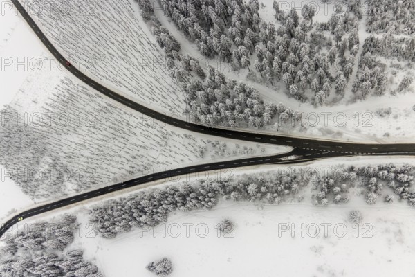 Aerial view of the snowy winter landscape of Winterberg with winding roads and paths with a