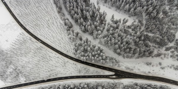 Aerial view of the snowy winter landscape of Winterberg with winding roads and paths with a