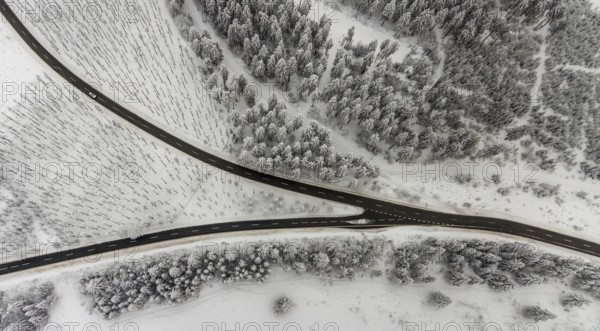 Aerial view of the snowy winter landscape of Winterberg with winding roads and paths with a