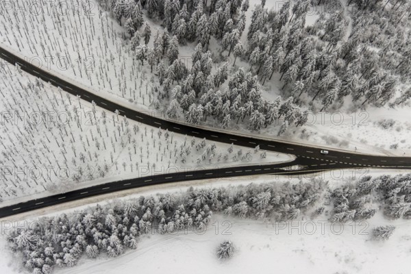 Aerial view of the snowy winter landscape of Winterberg with winding roads and paths with a