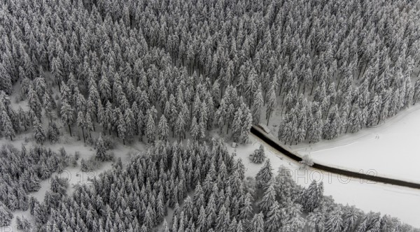 Aerial view of the snowy winter landscape of Winterberg with winding roads and paths in the