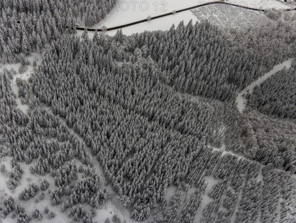 Aerial view of the snowy winter landscape of Winterberg with winding roads and paths in the