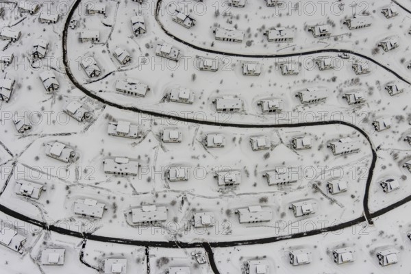 Aerial view of the snowy winter landscape of Winterberg with the deserted Landal Winterberg holiday