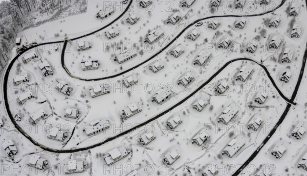 Aerial view of the snowy winter landscape of Winterberg with the deserted Landal Winterberg holiday