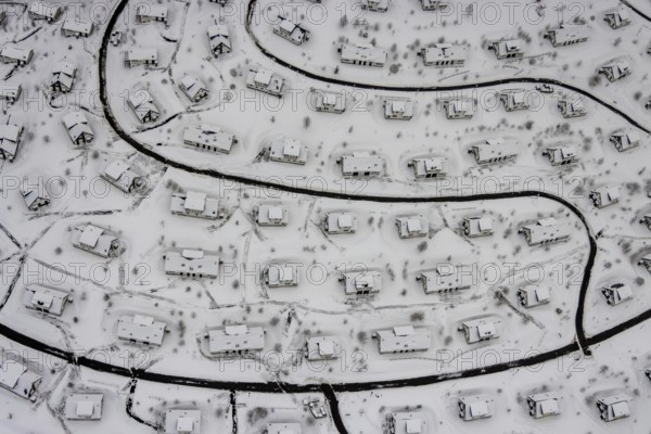Aerial view of the snowy winter landscape of Winterberg with the deserted Landal Winterberg holiday