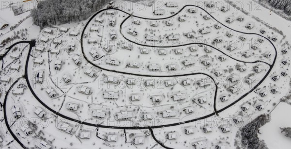 Aerial view of the snowy winter landscape of Winterberg with the deserted Landal Winterberg holiday