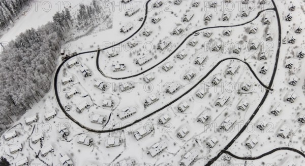 Aerial view of the snowy winter landscape of Winterberg with the deserted Landal Winterberg holiday